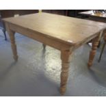 19th century stripped pine scrub top kitchen table. 135 x 89cm wide approx. (B.P. 21% + VAT)