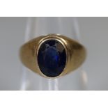 A 9ct gold synthetic sapphire ring. Ring size I&1/2. Approx weight 3.7 grams. (B.P. 21% + VAT)