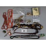 A collection of costume jewellery and beads etc, including an inlaid purse and seals. (B.P. 21% +