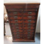Early 20th century walnut and mahogany tambour straight front filing cabinet, having a bank of 18
