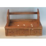 Small oak wall shelving unit having a bank of three drawers with turned handles. (B.P. 21% + VAT)