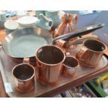 Tray of copper ware: two copper tankards and two small copper mugs, conical shaped copper jug, two