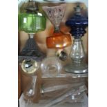 Box containing 3 oil lamps with coloured glass reservoirs and a 4th small clear glass oil lamp and 6