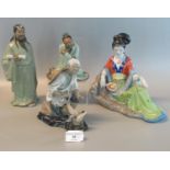 Three modern Chinese immortal pottery mud men, together with another modern Oriental figure of a