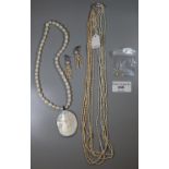 A Freshwater rice pearl necklace and earrings and a cultured freshwater pearl necklace. (B.P.