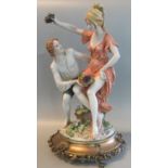 Capodimonte figure group of two lovers with fruit on a naturalistic and gilt metal base. Signed '
