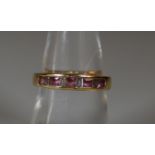 18ct gold pink sapphire and diamond half eternity style ring. Ring size N. Approx weight 3.4g. (B.P.