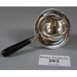 Early 20th century silver tea strainer, by S&M Birmingham, with turned wooden ebonised handle. (B.P.