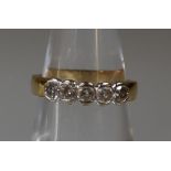 An 18ct gold five stone diamond ring. Ring size K. Approx weight 3.3g. (B.P. 21% + VAT)