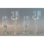 Pair of baluster beer glasses, together with a pair of wine glasses with air twist stems and