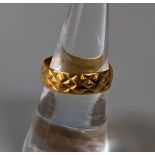 A 22ct gold engraved wedding ring. Ring size N. Approx weight 4.1g. (B.P. 21% + VAT)