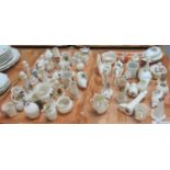 Two trays of assorted miniature crested ware to include: a lidded dish in the shape of a fish,