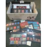 Shoebox of World stamps on cards in packets, covers etc. 100's mint and used. (B.P. 21% + VAT)