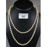 A String of cultured pearls and a string of Monet simulated pearls. (B.P. 21% + VAT)