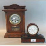 Edwardian Walnut and ebonised drum mantle clock, together with an early 20th century oak two train