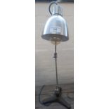 Brushed steel angle poise type desk lamp with cast iron triform base. (B.P. 21% + VAT)