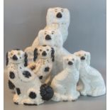 Three pairs of Staffordshire pottery fireside seated spaniels, all with painted features. (6) (B.