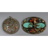 A Chinese white metal pendant and a brass brooch. (B.P. 21% + VAT)