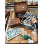 Two carved sandalwood boxes, a glass casket with postcards and a Schuco wind-up Volkswagen car