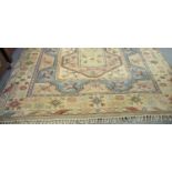 Beige, green and blue ground Kelim type carpet overall decorated with stylised flowers and