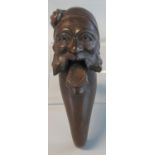 19th century carved wooden nut-cracker in the form of a be-whiskered man's head. Probably south
