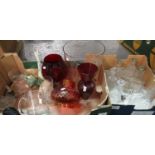 Two boxes of assorted glassware to include: cranberry vase with a clear glass stem, 2 other
