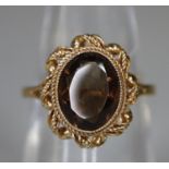 9ct gold smokey quartz ring. Ring size L&1/2. Approx weight 3.g (B.P. 21% + VAT)