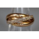 18ct gold diamond set crossover ring. Estimated diamond weight 0.38cts. Ring size O. Approx weight