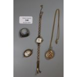 A Lady?s 9ct gold wristwatch, a cameo brooch, gold plated locket and a ring. (B.P. 21% + VAT)