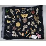 A collection of vintage brooches including a dragonfly, letter, ?K? bird brooches etc. (B.P. 21% +