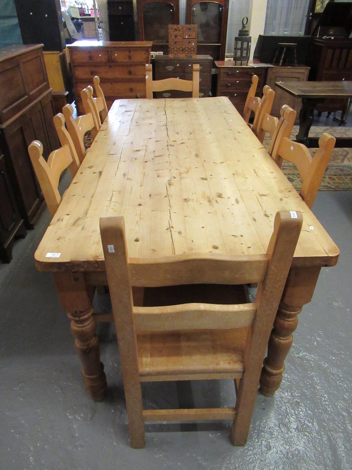 Large pine farmhouse kitchen table on baluster turned legs together with a set of eight beech