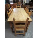 Large pine farmhouse kitchen table on baluster turned legs together with a set of eight beech