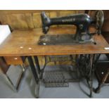 Early 20th century Singer sewing machine on oak stand with cast iron Singer base. (B.P. 21% + VAT)