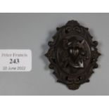 A large black Victorian brooch decorated with, ?Faith, Hope and Charity? motif. (B.P. 21% + VAT)