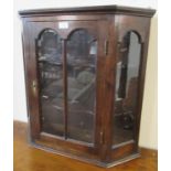 Good quality oak hanging single door glazed display cabinet with two shaped shelves to the interior.