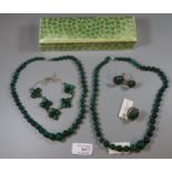 Collection of Malachite jewellery including two strings of beads, two rings and a necklace. (B.P.