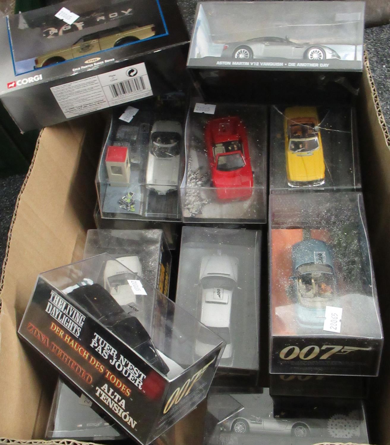 Box comprising Corgi and other 007 James Bond vehicles in original boxes, to include: gold painted