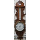 Early 20th century carved oak aneroid barometer marked Jenkins &Co Carmarthen. (B.P. 21% + VAT)