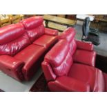 Two similar modern red leather two-seater electrical reclining sofas. (2) (B.P. 21% + VAT)