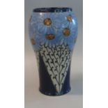 Royal Doulton stoneware vase having stylised floral and foliate decoration on a blue ground.