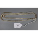 A double strand of graduated cultured pearls with a 9ct white gold diamond set clasp. (B.P. 21% +