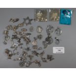 A large collection of silver charms. (B.P. 21% + VAT)