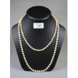 A String of cultured pearls and a string of Monet simulated pearls. (B.P. 21% + VAT)