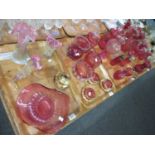 Four trays of largely cranberry glass items, to include: a mid 19th century fluted edge bowl, and a,