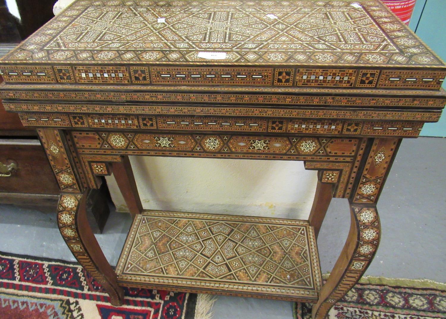 Middle Eastern Moorish marquetry and parquetry inlaid folding games table on stand with under-