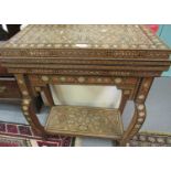 Middle Eastern Moorish marquetry and parquetry inlaid folding games table on stand with under-