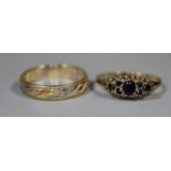 An 18ct three colour gold wedding ring and a 9ct gold sapphire ring. Ring size N and M. Approx