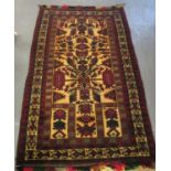 Rectangular rug in maroon, beige, black, green and red with short fringe