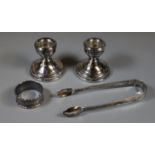 Small collection of silver items to include: sugar nips, engine turned napkin ring and a pair of