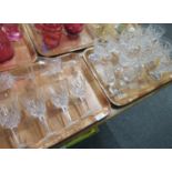 Two trays of cut glass glassware to include: wine glasses, sherry glasses and 6 Stuart crystal,